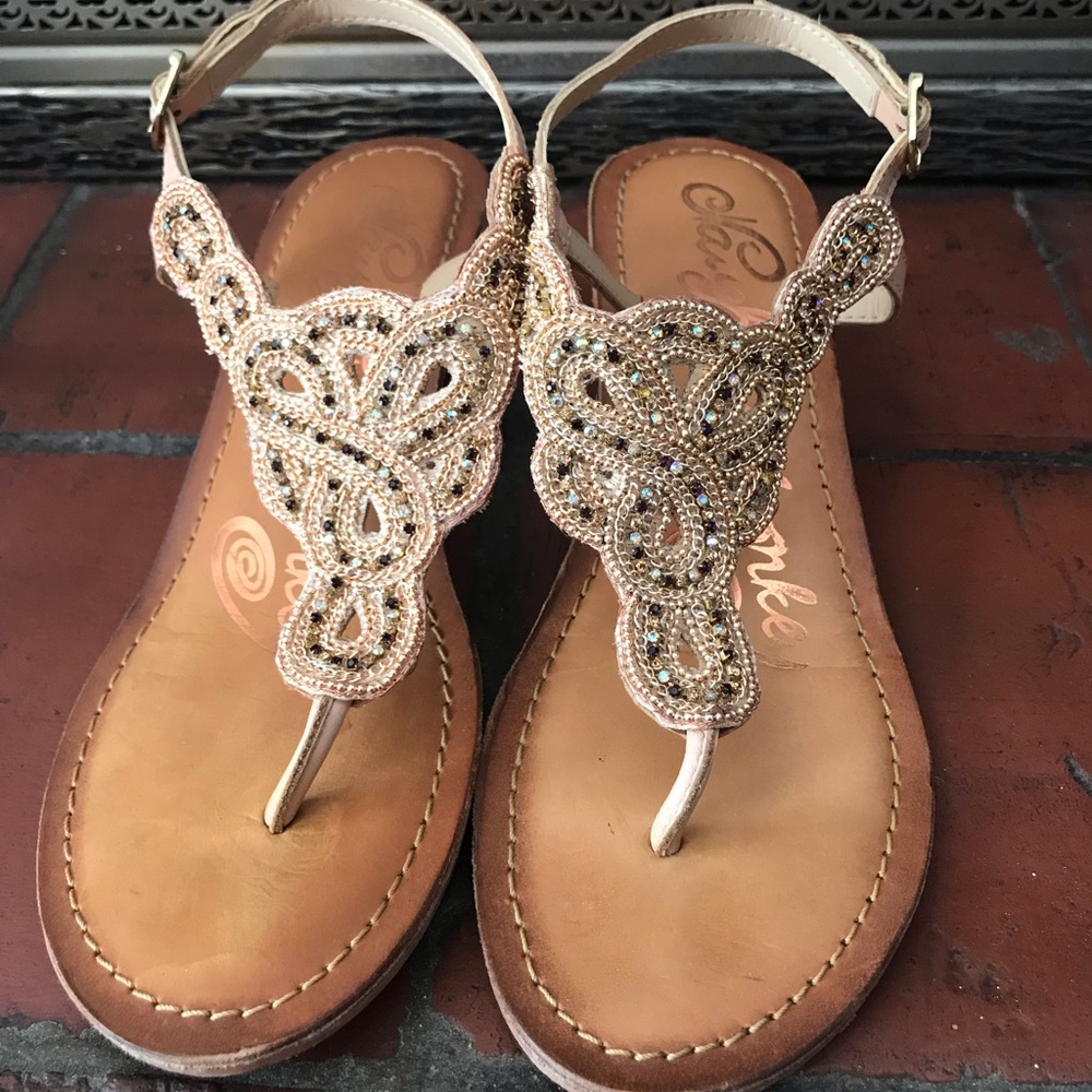 Cute beaded wooden wedge sandals.